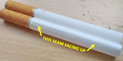 Cigarette tube with seam facing up